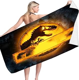 chica secándose con toalla de dinosaurio