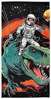 toalla de baño con patron de astronauta montado en un dinosaurio