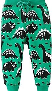 Pantalones verdes de deporte con dinosaurios de dibujos negros