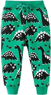 Pantalones verdes de deporte con dinosaurios de dibujos negros